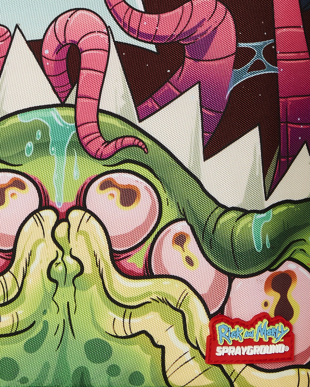 SPRAYGROUND® BACKPACK RICK AND MORTY DLXR ALIEN MOUTH HALF SHARKMOUTH DLXR BACKPACK