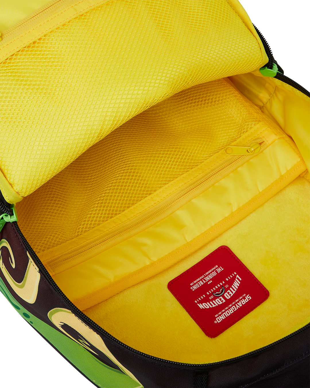 SPRAYGROUND® BACKPACK RICK AND MORTY DLXR ALIEN MOUTH HALF SHARKMOUTH DLXR BACKPACK